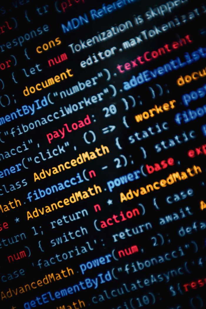 about-img Close-up of vibrant JavaScript code displayed on a monitor showcasing web development.